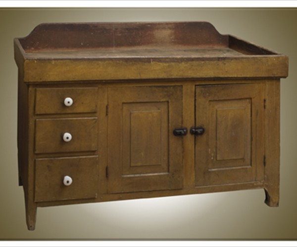 Not all Soap Hollow furniture was treated to decorative painting or stencils. This plain but very functional kitchen dry sink and cupboard received just a coat of pumpkin yellow paint, although the drawer knobs do provide a decorative element. Private collection. Photo credit: Rick Povich.